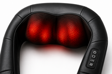 Black neck and shoulder massage pillow with two glowing red heated massage nodes and a control panel on the side, shown on a white background.